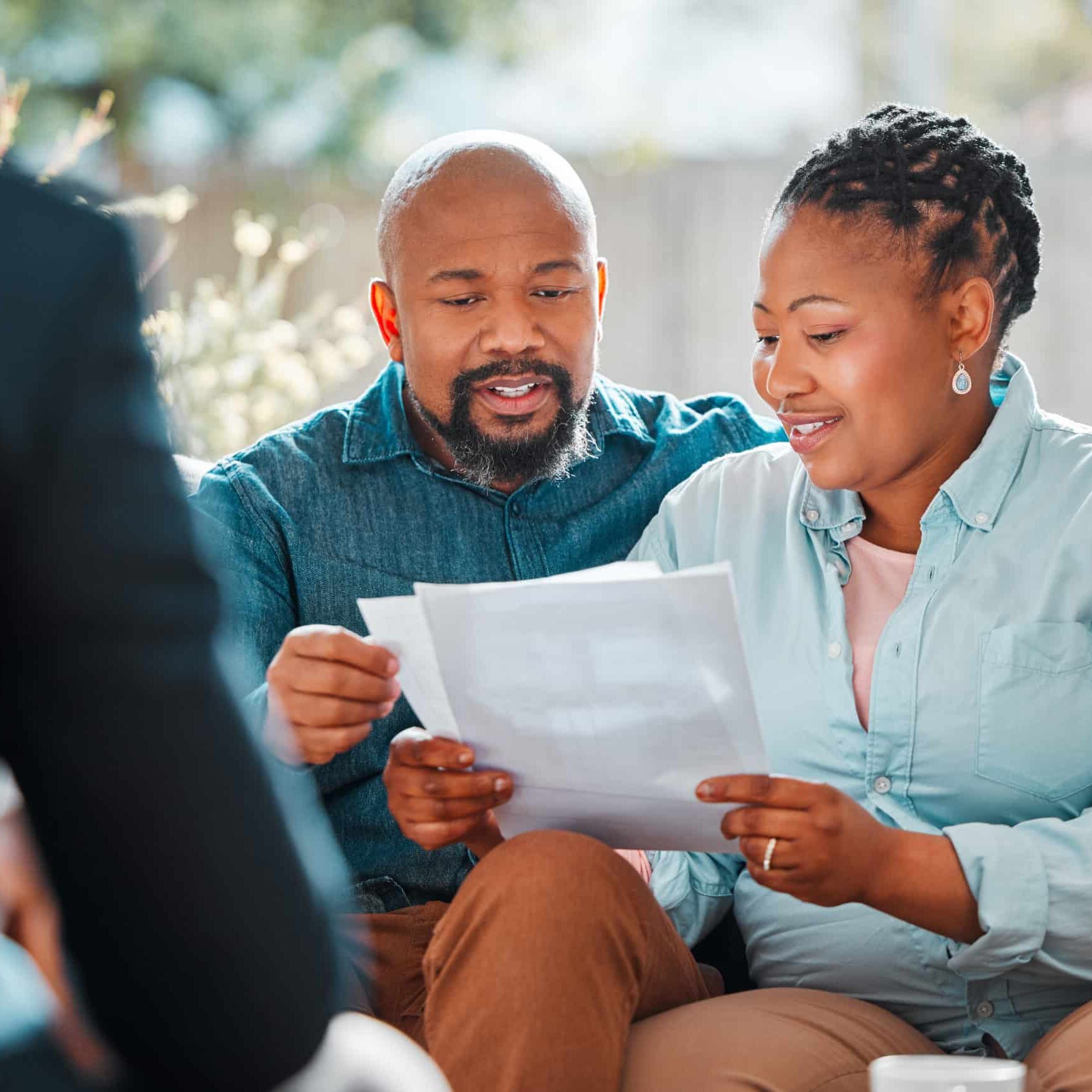 Happy couple, broker and contract in a house for a meeting or consultation for retirement advice. Financial advisor, black man and woman for investment, savings plan or pension and insurance paper.